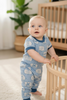 Lt. blue cowboy printed boys baby romper with snaps. SR100107-JEAN