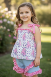 Purple/pink floral tunic with gingham straps and blue shorts. OFG53421 SOL