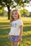 "American Girl" Ivory ruffle top and flag printed shorts with ruffle detail. OFG60804 JEAN