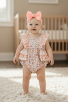 Lt. Coral printed baby romper with ruffle butt. RPG61175 JEAN