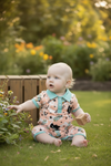Howdy cow spotted baby romper w/ dusty green hem & snaps. RPB60248 AMY