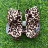 6.5" Tan cheetah printed /rhinestone alligator hair bow. 4pcs/$10.00 B102