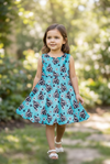 Turquoise cow tag printed scallop hem dress & black shorts. OFG61008 AMY