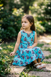 Turquoise cow tag printed scallop hem dress & black shorts. OFG61008 AMY