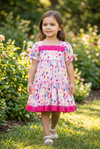 Floral printed flare dress with fuchsia embroidered hem. DRG15144019 SOL