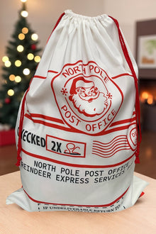  19" X 27"North Pole Post office Checked twice" Santa printed Christmas sack. SC-19