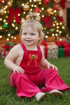 Christmas character on fuchsia velvety fabric romper. PNG50763 SOL