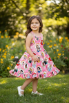 Pink character printed girls dress with ruffle hem. DRG60223 AMY