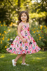 Pink character printed girls dress with ruffle hem. DRG60223 AMY