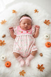 Pink pumpkin printed baby romper with embroidered detail. RPG64338 SOL