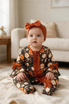 Floral printed baby bodysuit with ruffle hem. RPG65390 SOL