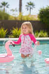 Ditsy floral swimsuit with fuchsia long sleeves. Amy