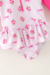 Ditsy floral swimsuit with fuchsia long sleeves. Amy