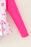Ditsy floral swimsuit with fuchsia long sleeves. Amy