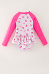 Ditsy floral swimsuit with fuchsia long sleeves. Amy