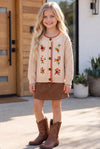 Cream cable knit cardigan with embroidered flowers. TPG60611 AMY