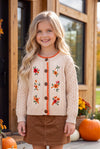 Cream cable knit cardigan with embroidered flowers. TPG60611 AMY