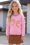 Lt. Pink knit sweater with bow applique and moon stitch trim. TPG60757 MON