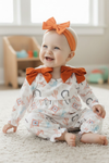 Howdy" printed girls baby romper w/rust side bows. A2026-Sol