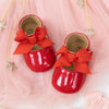 Red infant shoes with red front bow & velcro for easy off on. HMZ1615R