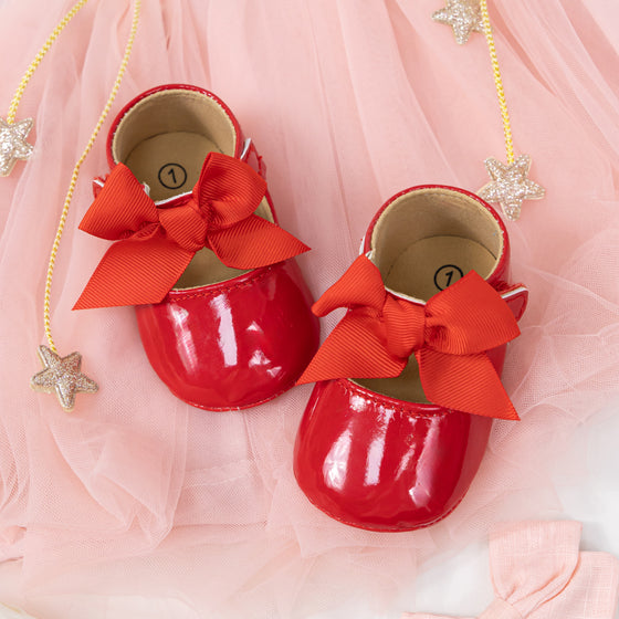 Red infant shoes with red front bow & velcro for easy off on. HMZ1615R