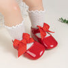 Red infant shoes with red front bow & velcro for easy off on. HMZ1615R