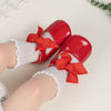 Red infant shoes with red front bow & velcro for easy off on. HMZ1615R