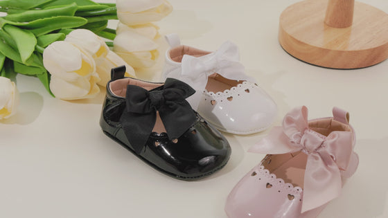 Cute heart pink front satin bow baby shoes. CG5369