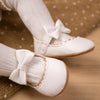 White pleather baby shoes. HM1628