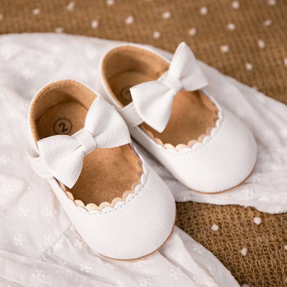 White pleather baby shoes. HM1628