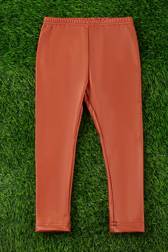 RUST FAUX LEATHER LEGGINGS. PNG65153008-JEANN