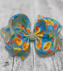 FRESH ORANGE PRINTED HAIR BOWS WITH RHINESTONES 7.5IN WIDE 4PCS/$10.00 BW-DSG-359