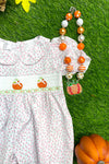 (ONLINE ONLY) PINK FLORAL PRINT SMOCK BABY ROMPER WITH PUMPKIN EMBROIDERY. RPG401522010