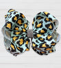 BLUE ANIMAL PRINTED HAIR BOWS. 7.5" WIDE 4PCS/ $10.00 BW-DSG-458